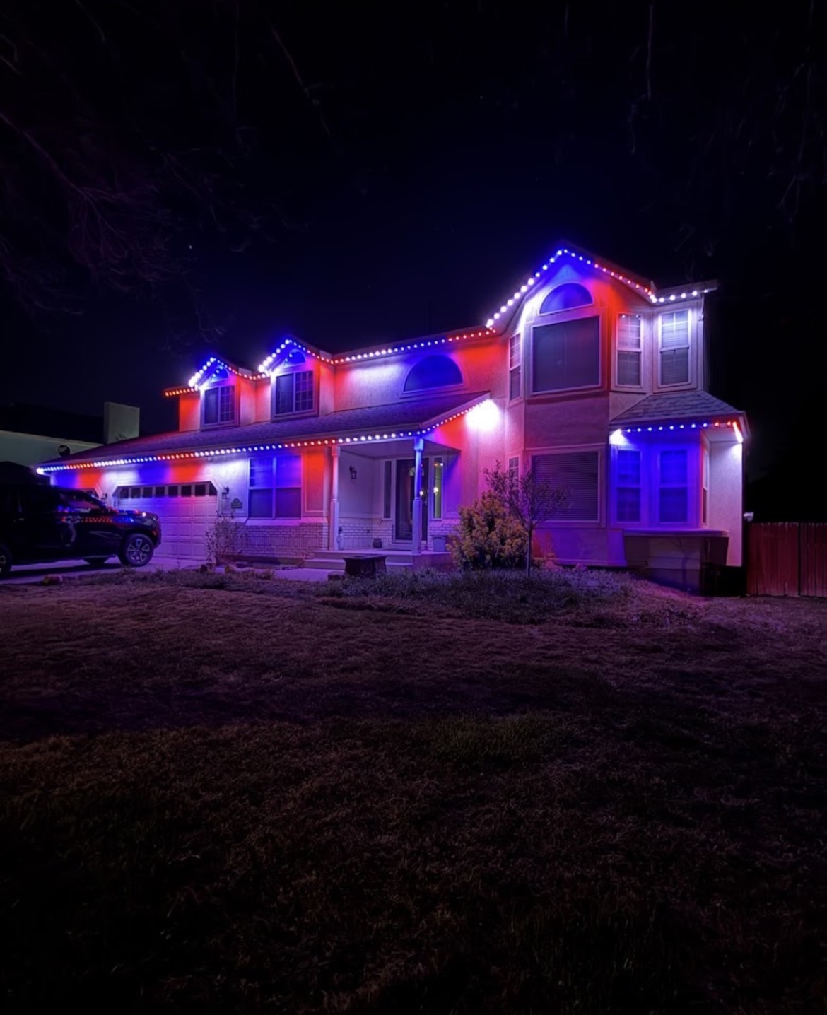 Red white and blue permanent roofline lighting